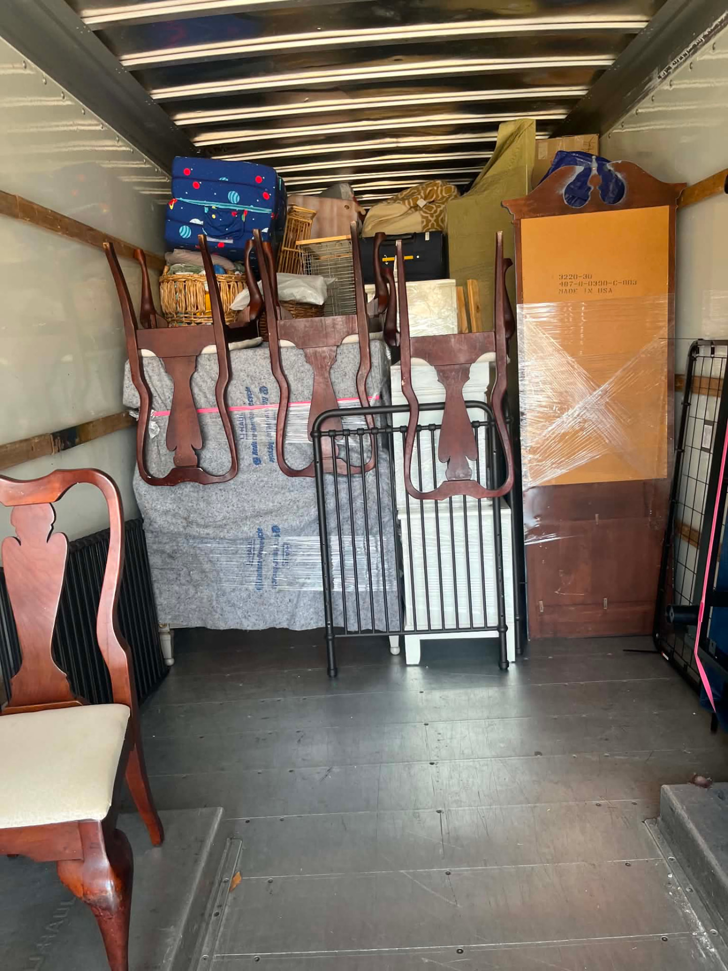 Carefully loaded furniture inside a moving truck