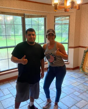 Happy customers giving thumbs up after a smooth move