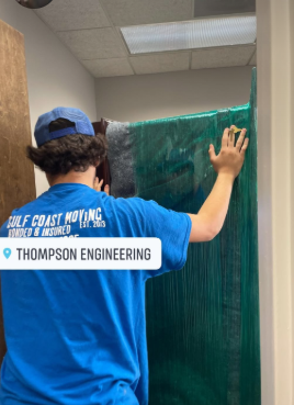 Mover wrapping a glass wall at Thompson Engineering